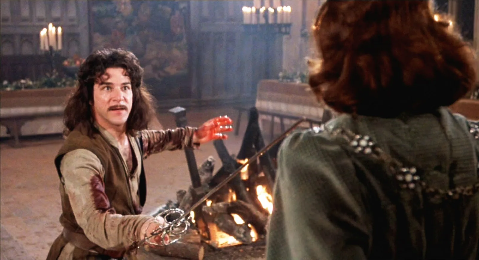 Mandy Patinkin as Inigo Montoya in The Princess Bride, bloodied hand extended in a dramatic scene