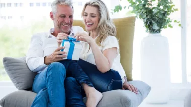 Gadgets, Gear, and Gizmo Gifts for Empty Nesters 16 Smiling mature couple with gifts for empty nesters