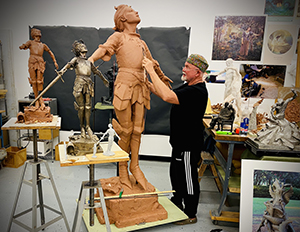 Gary Lee Price Sculpting in His Studio