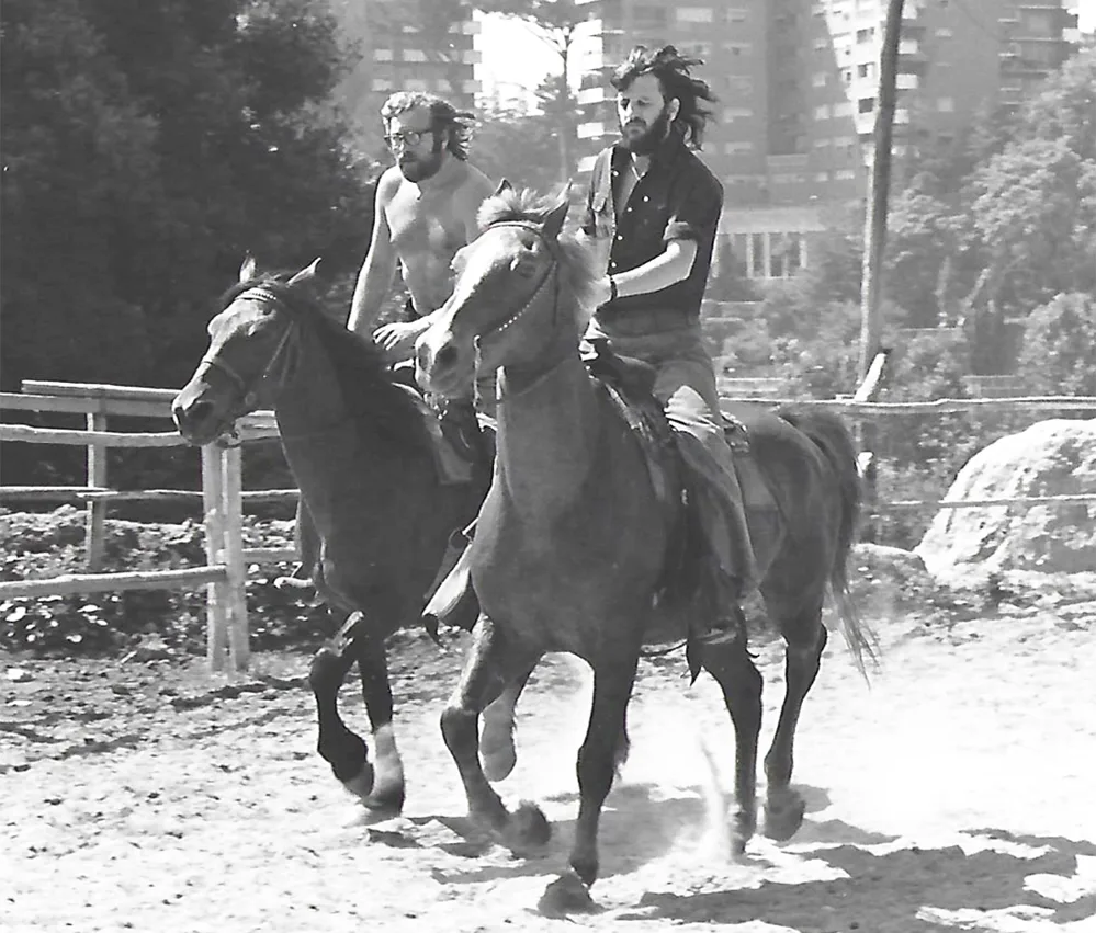 Living the Beatles Legend 6 Mal Evans and Ringo Starr on horseback on the set of the 1971 film Blindman.