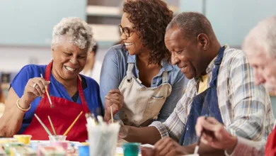 5 Ways You Can Support Seniors in Your Local Community 1 Seniors participating in a community painting class, fostering creativity and social connection.