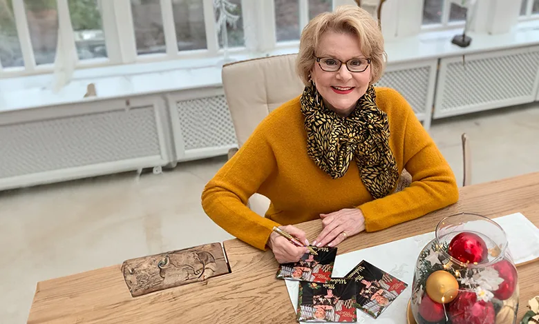 Why “I Will Follow Him” Still Follows Peggy March—60 Years Later 1 Peggy March smiling at the camera while signing an autograph.