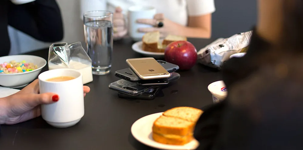 Social Media Isn’t 'Reel' 2 cell phones at table 5 W