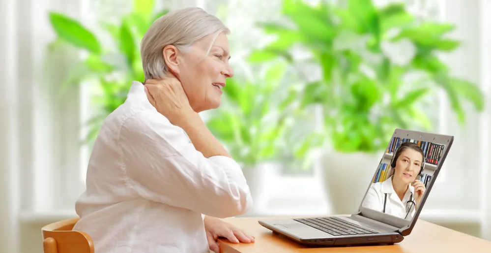 Improving Post-Hospital Outcomes for Older Adults 2 Older adult patient participating in a telehealth consultation with a doctor.