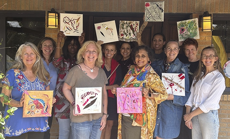 Breast Cancer Survivors Exhibition 1 Group of breast cancer survivors and local Dallas artists holding original art pieces created in a therapeutic retreat at Rachel Larlee Studio.