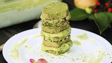 Matcha Ice Cream Cookie Sandwiches 1 Stack of homemade matcha ice cream sandwiches with green tea ice cream between vanilla cookies on a white plate