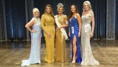 From Pickleball to Pageantry 6 Five women in formal gowns pose together on stage after the Ms. Senior World pageant, with the winner in the center wearing a crown and sash