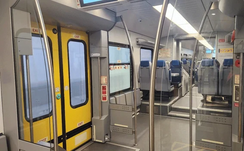 New DART Silver Line: The Easy Way to DFW Airport 2 DART Silver Line train interior showing wide accessible entrance with yellow doors grab bars and comfortable blue seating