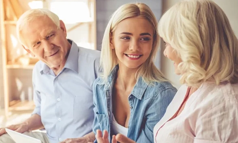 Elderly parents and adult daughter having a warm conversation about estate planning
