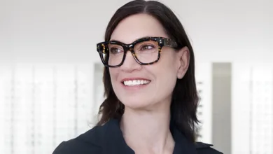 Through Ada's Eyes: How New Glasses Changed My Perspective at 52 1 A poised woman wearing tortoiseshell Mensa eyeglass frames, reflecting smart and confident style.