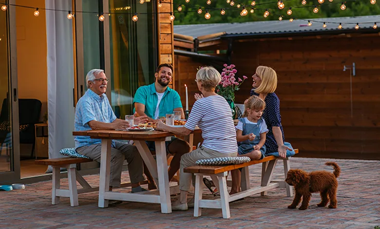 Strength in Time of Grief 1 A multigenerational family eating outside on the patio