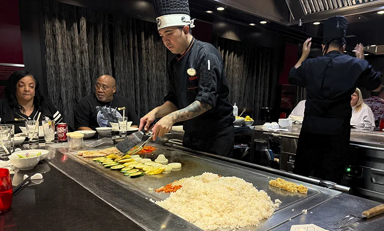 What is Specialty Dining on a Cruise? 1 Teppanyaki chef at Izumi, a specialty dining option on a Harmony of the Seas cruise