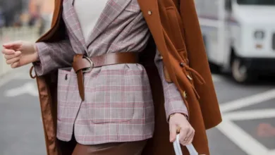Cognac leather belt adding definition to a layered blazer