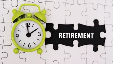 Why 87% of Retirees Wish They'd Been Better Prepared— It's Not About Money 12 Alarm clock and puzzle pieces with the word retirement representing non-financial retirement planning