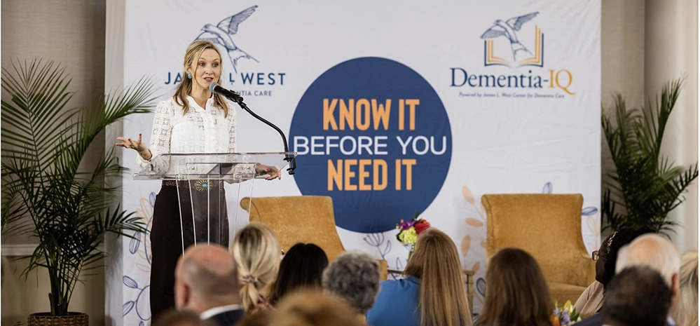 Fort Worth Mayor Mattie Parker speaks at a podium in front of the “Know It Before You Need It” event backdrop.