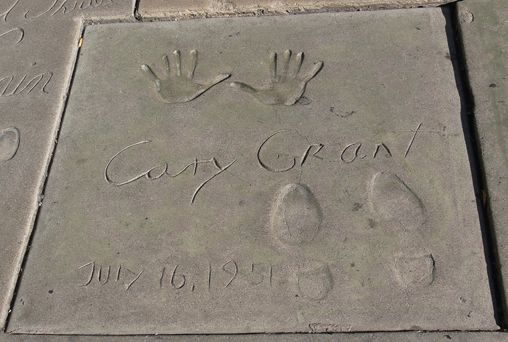 Cary Grant's handprints, footprints, and signature in concrete at the Chinese Theatre, dated July 16, 1951.