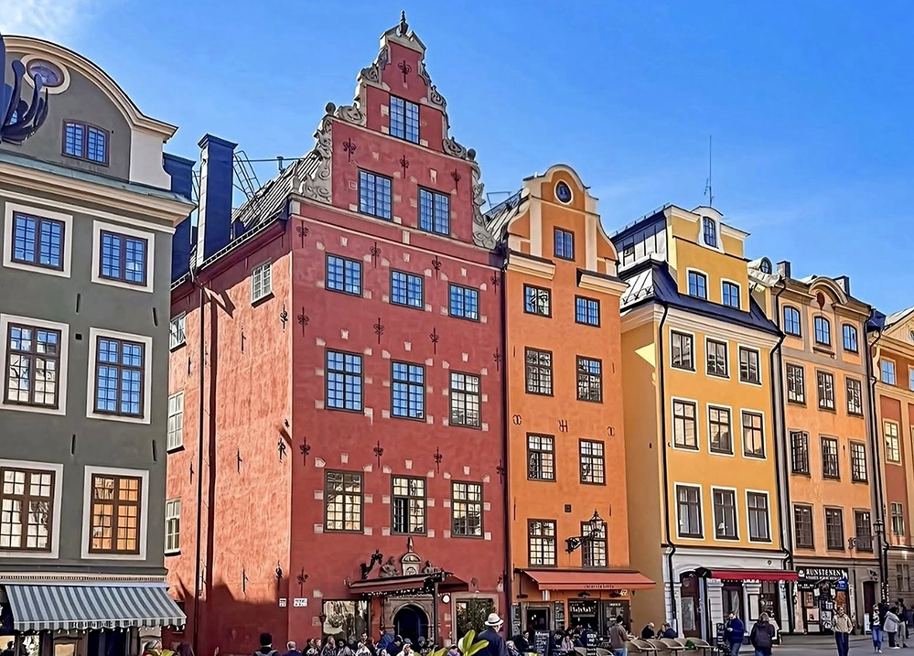 Colorful gabled merchant houses lining Stortorget square in Stockholm’s Gamla Stan old town