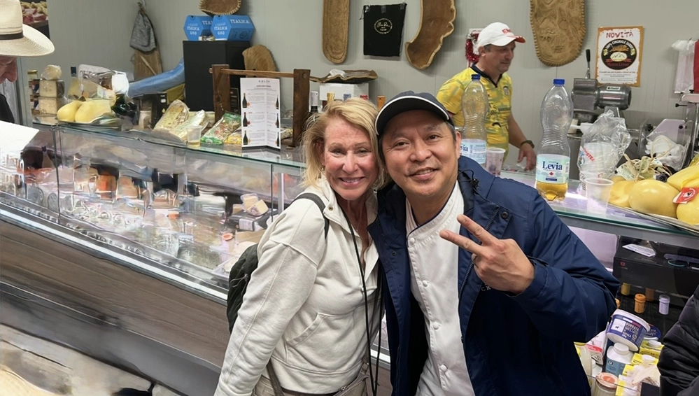 Think You Don't Like Cruises? You Might Just Be on the Wrong Ship 2 Sharon Kurtz with Executive Chef Neil Romulus at a market stall in Cagliari, Sardinia